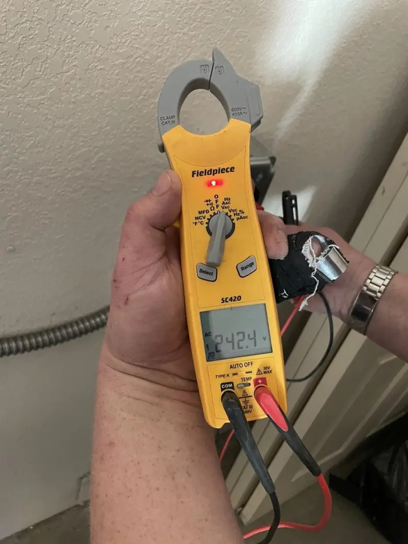 Voltage testing with clamp meter during Outlet Installation in Rockcreek